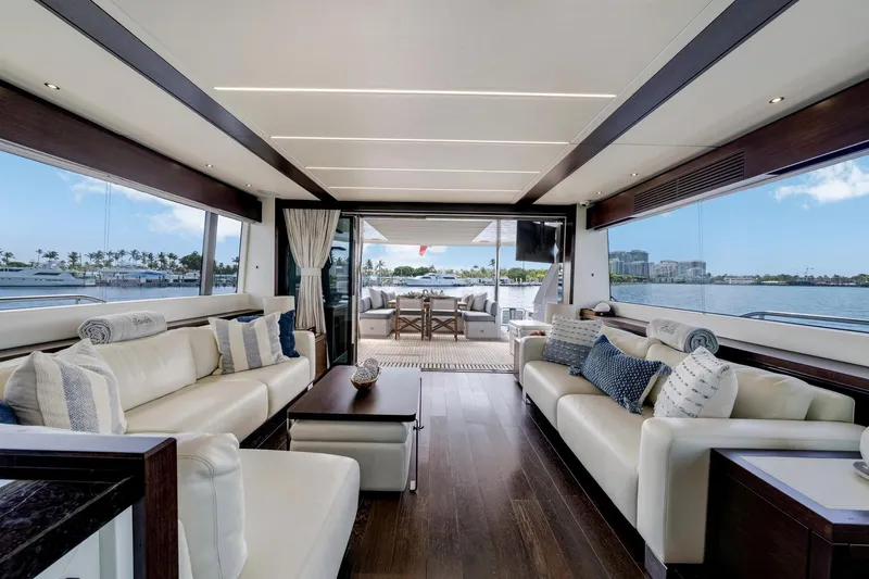  Yacht Photos Pics Luxurious interior of 2021 Sunseeker 76 Yacht with elegant seating and scenic ocean view.