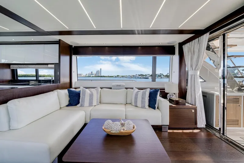  Yacht Photos Pics Luxurious interior of 2021 Sunseeker 76 Yacht with elegant seating and scenic ocean view.