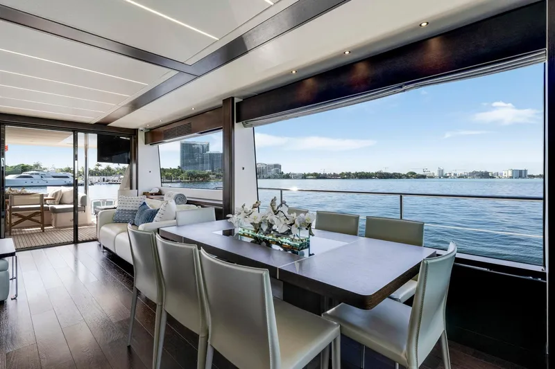  Yacht Photos Pics Luxurious interior of 2021 Sunseeker 76 Yacht with elegant dining area and ocean view.