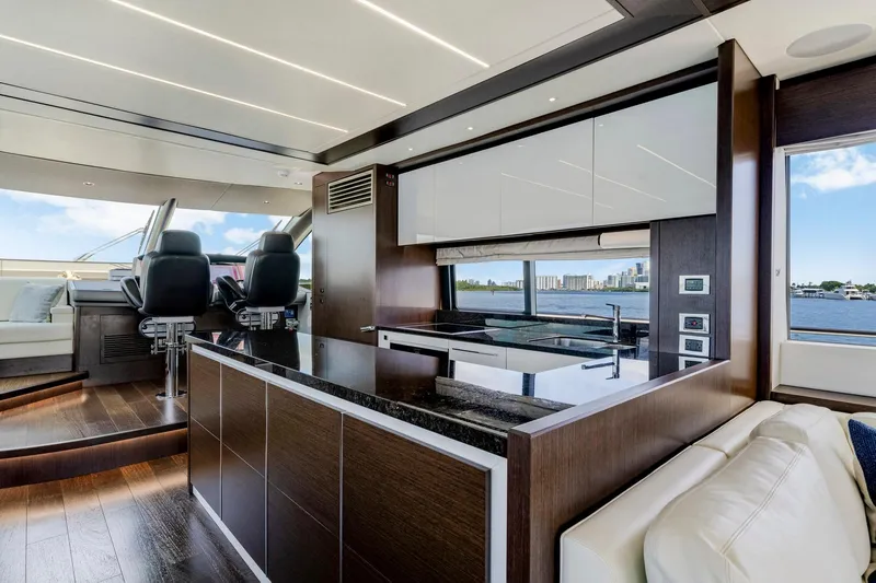  Yacht Photos Pics Luxurious interior of 2021 Sunseeker 76 Yacht with modern kitchen and scenic water views.