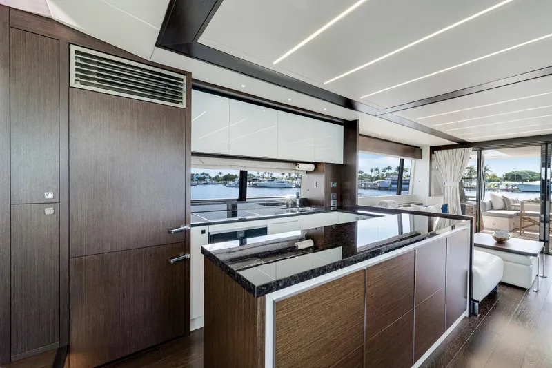  Yacht Photos Pics Luxurious interior of 2021 Sunseeker 76 Yacht with modern kitchen and scenic views.