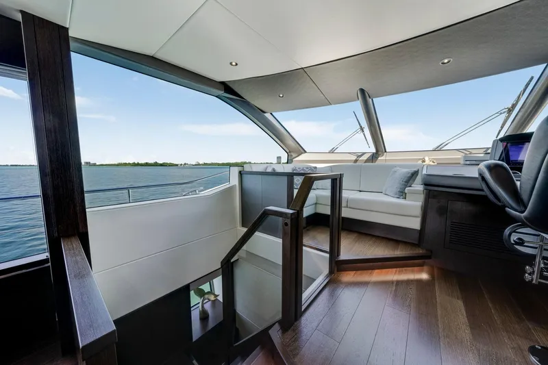  Yacht Photos Pics Luxurious interior of 2021 Sunseeker 76 Yacht with panoramic windows and elegant seating.