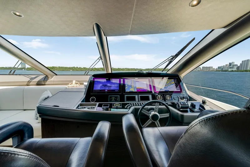  Yacht Photos Pics Luxurious Sunseeker 76 Yacht 2021 helm with advanced navigation systems and panoramic water views.