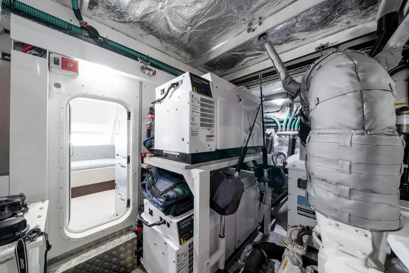  Yacht Photos Pics Engine room of 2021 Sunseeker 76 Yacht, featuring modern equipment and insulation.
