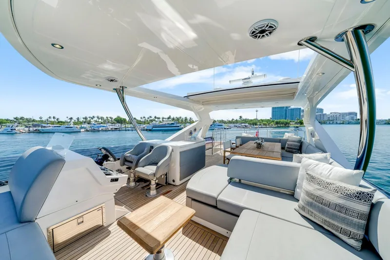  Yacht Photos Pics Luxurious 2021 Sunseeker 76 Yacht interior with elegant seating and scenic marina view.