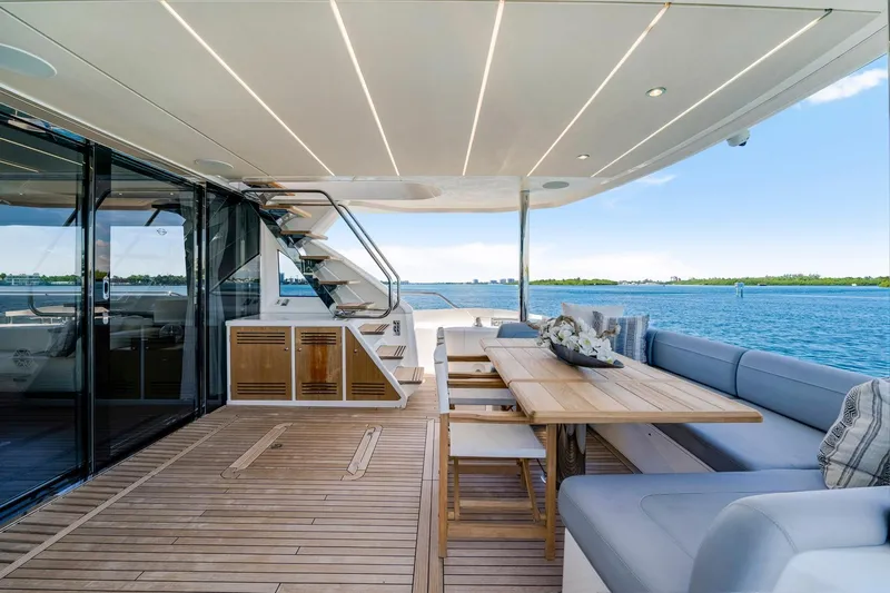 Yacht Photos Pics Luxurious 2021 Sunseeker 76 Yacht deck with elegant seating and ocean view.