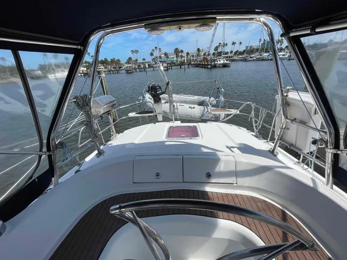 Sapphire Seas Yacht Photos Pics Hunter 45 Center Cockpit sailboat, 2006 model, docked at marina with scenic water view.