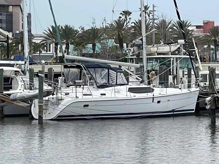 Sapphire Seas Yacht Photos Pics 2006 Hunter 45 Center Cockpit sailboat docked at a marina.
