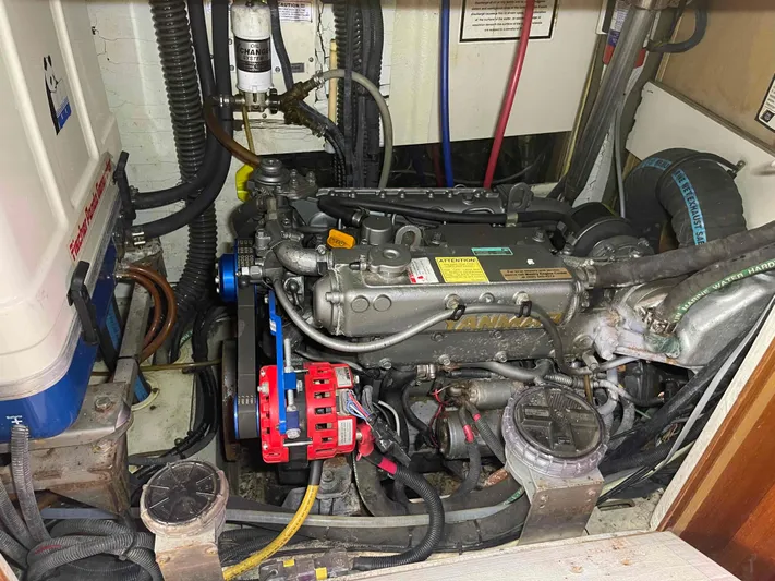 Sapphire Seas Yacht Photos Pics Engine compartment of a 2006 Hunter 45 Center Cockpit sailboat, showing detailed machinery and components.