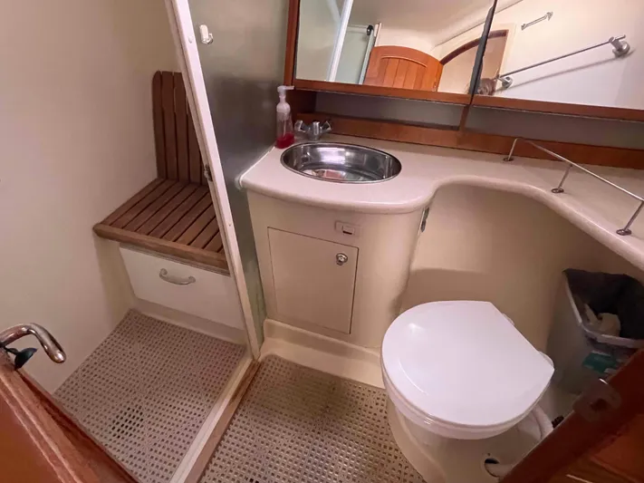 Sapphire Seas Yacht Photos Pics Bathroom interior of 2006 Hunter 45 Center Cockpit yacht with sink and toilet.