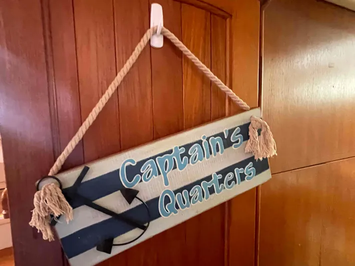 Sapphire Seas Yacht Photos Pics "Captain's Quarters" sign on 2006 Hunter 45 Center Cockpit boat interior door.