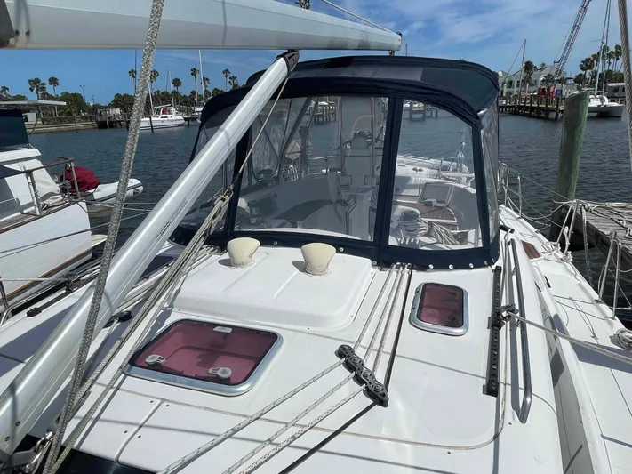 Sapphire Seas Yacht Photos Pics 2006 Hunter 45 Center Cockpit sailboat docked, featuring a spacious cockpit and clear blue skies.