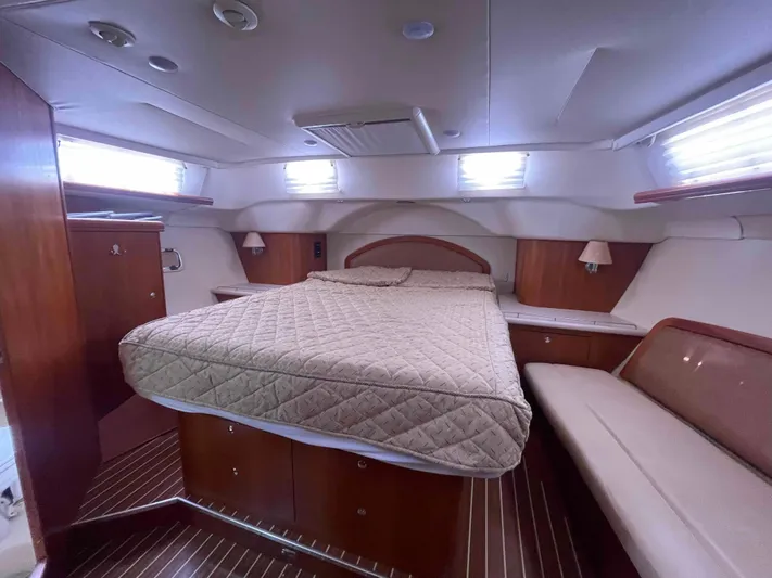 Sapphire Seas Yacht Photos Pics Luxurious cabin interior of 2006 Hunter 45 Center Cockpit yacht with cozy bed and seating.