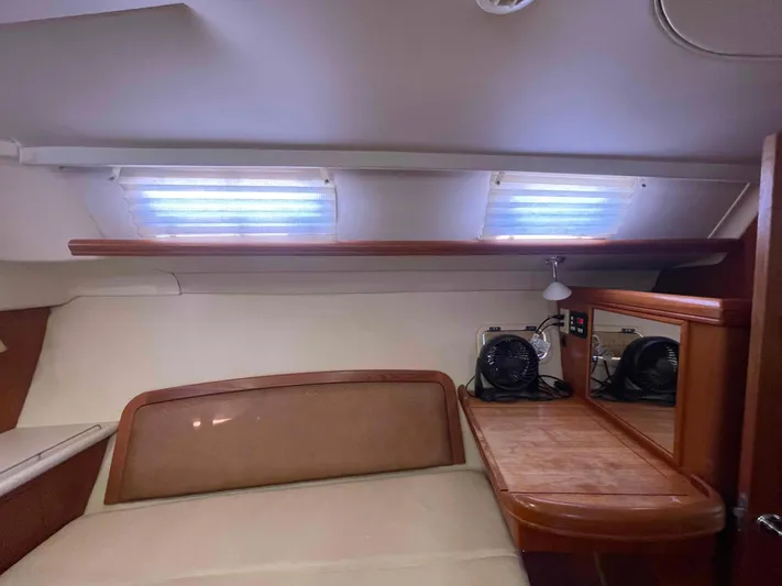 Sapphire Seas Yacht Photos Pics Interior cabin of 2006 Hunter 45 Center Cockpit sailboat with bed and desk area.