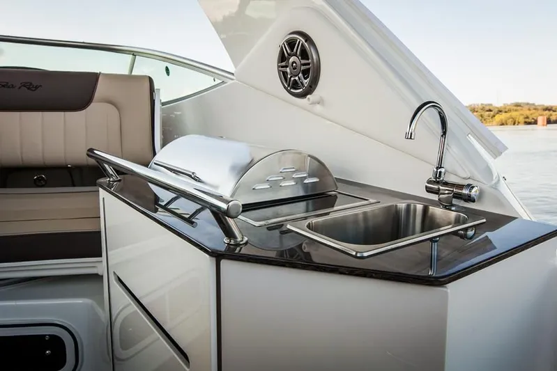 Luna Sea Yacht Photos Pics Outdoor kitchenette on 2015 Sea Ray 310 Sundancer yacht with sink and grill.
