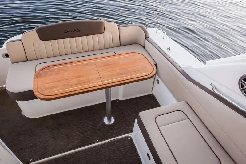 Luna Sea Yacht Photos Pics 2015 Sea Ray 310 Sundancer boat interior with seating and wooden table.