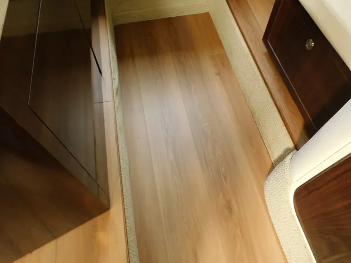 Luna Sea Yacht Photos Pics Interior view of 2015 Sea Ray 310 Sundancer with wood flooring and cabinetry.