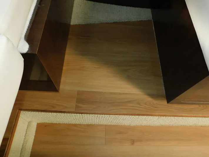 Luna Sea Yacht Photos Pics Interior of 2015 Sea Ray 310 Sundancer with wooden flooring and carpet.