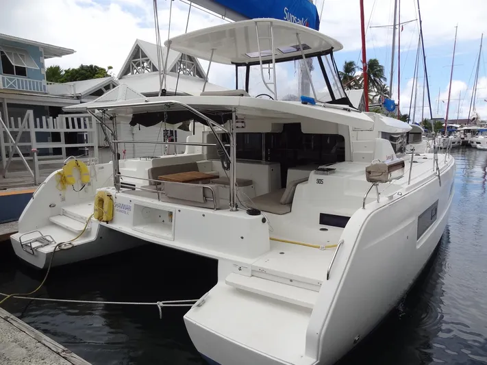 Shamwari Yacht Photos Pics 2020 Lagoon 46 catamaran docked at marina, showcasing spacious deck and modern design.