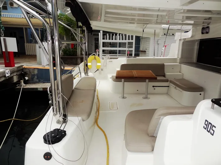 Shamwari Yacht Photos Pics Spacious deck of 2020 Lagoon 46 catamaran with seating and table.