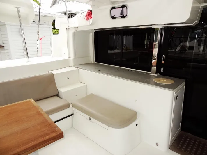 Shamwari Yacht Photos Pics 2020 Lagoon 46 yacht interior with seating and table in a modern design.