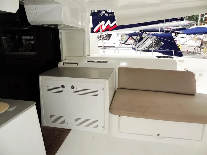 Shamwari Yacht Photos Pics Interior of 2020 Lagoon 46 yacht with seating and storage area.