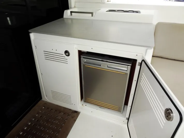 Shamwari Yacht Photos Pics Compact kitchenette with mini fridge on 2020 Lagoon 46 yacht.