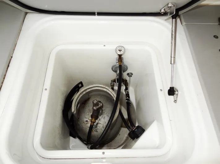 Shamwari Yacht Photos Pics Storage compartment with gas cylinder and hoses on a 2020 Lagoon 46 yacht.
