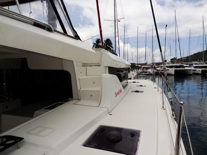 Shamwari Yacht Photos Pics 2020 Lagoon 46 catamaran docked at marina, surrounded by other sailboats.