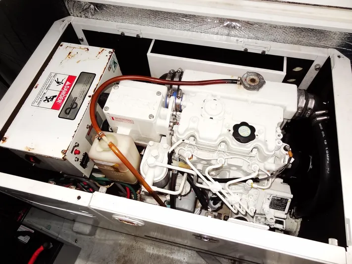 Shamwari Yacht Photos Pics Engine compartment of a 2020 Lagoon 46 catamaran, showcasing mechanical components and wiring.