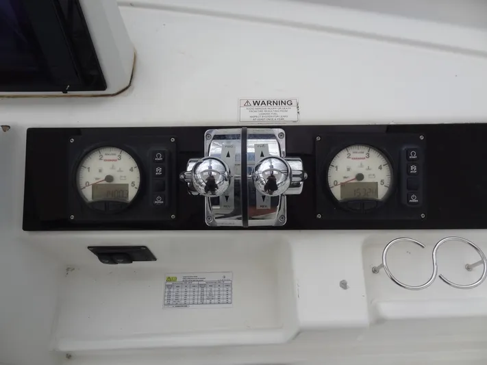 Shamwari Yacht Photos Pics Control panel of a 2020 Lagoon 46 catamaran with gauges and throttle levers.