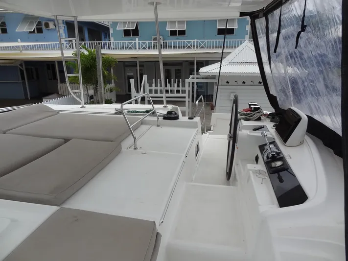 Shamwari Yacht Photos Pics 2020 Lagoon 46 yacht deck with helm, seating, and modern design.
