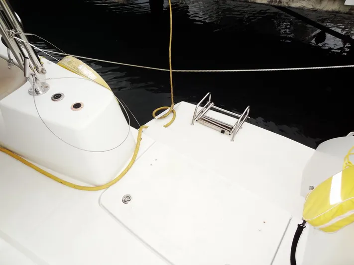 Shamwari Yacht Photos Pics Lagoon 46 catamaran deck, 2020 model, featuring a clean white surface and safety equipment.