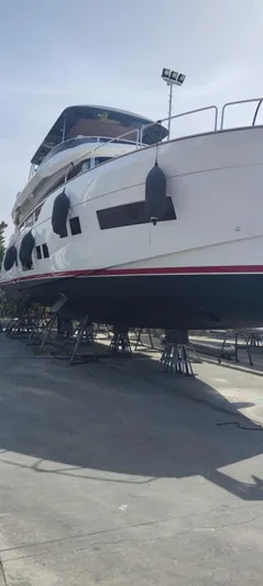  Yacht Photos Pics 2023 Sirena 68 yacht on dry dock, showcasing sleek design and modern features.