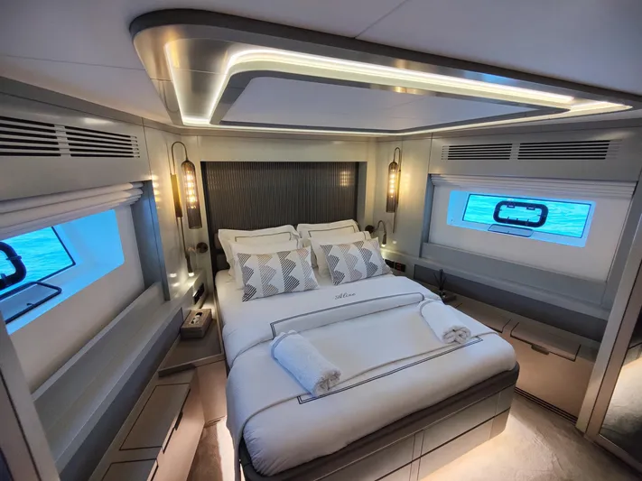  Yacht Photos Pics Luxurious bedroom interior of 2023 Sirena 68 yacht with modern design and ocean view.