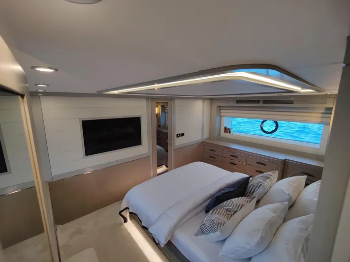  Yacht Photos Pics Luxurious interior of 2023 Sirena 68 yacht with elegant bedroom and ocean view.
