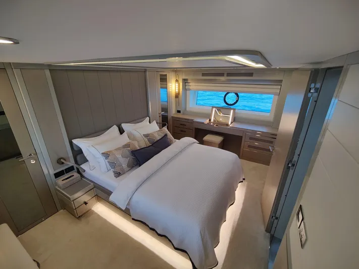  Yacht Photos Pics Luxurious bedroom interior of 2023 Sirena 68 yacht with ocean view window.