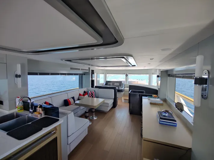  Yacht Photos Pics Luxurious interior of 2023 Sirena 68 yacht with modern furnishings and ocean view.
