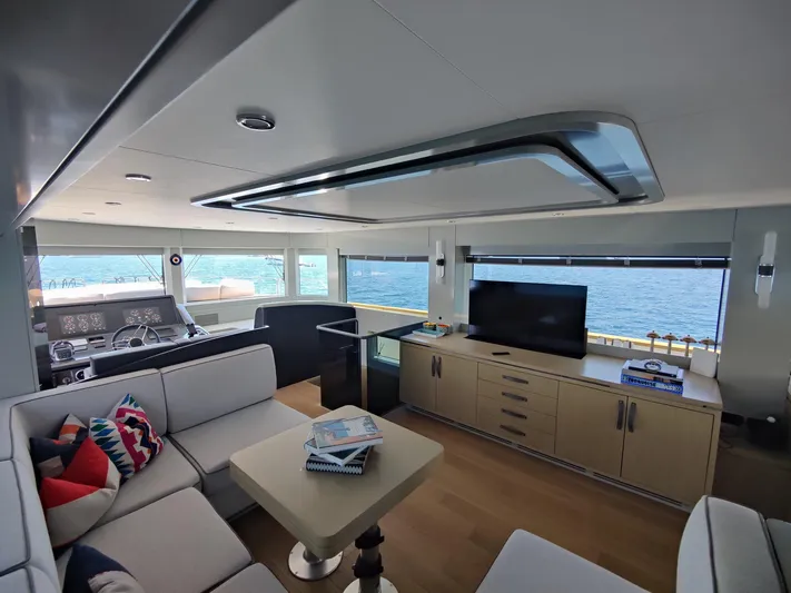  Yacht Photos Pics Luxurious interior of 2023 Sirena 68 yacht with modern furnishings and ocean view.