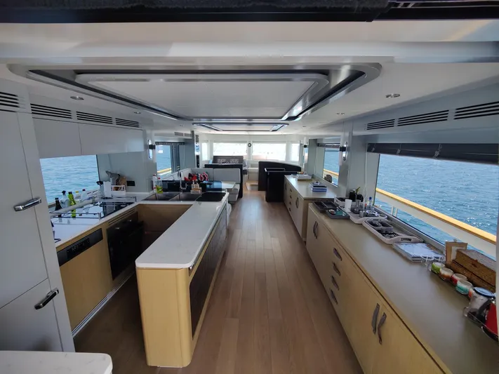  Yacht Photos Pics Luxurious interior of 2023 Sirena 68 yacht with modern kitchen and ocean view.