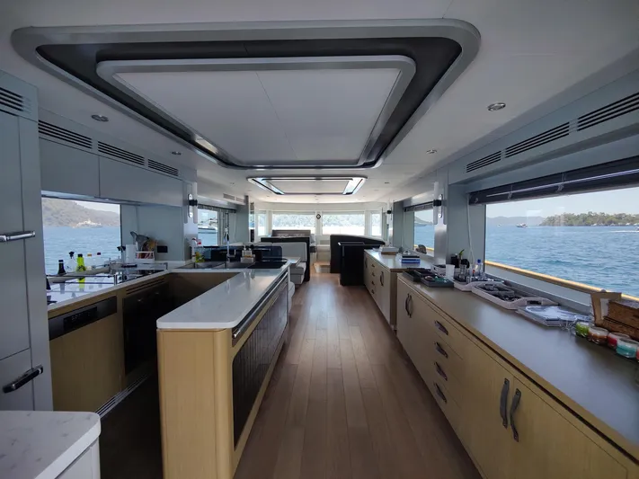  Yacht Photos Pics Luxurious interior of 2023 Sirena 68 yacht with modern kitchen and ocean view.
