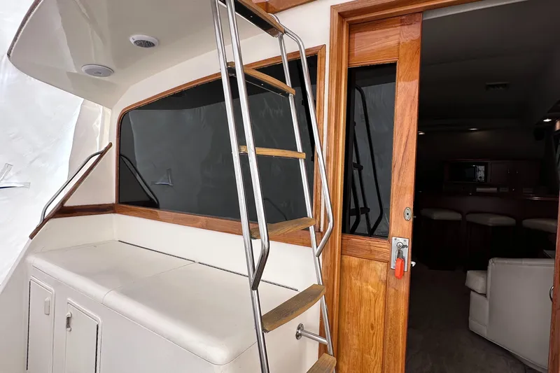 Saylor Moon Yacht Photos Pics Ocean Yachts 48 Super Sport 1990, cabin entrance with ladder and wooden door.