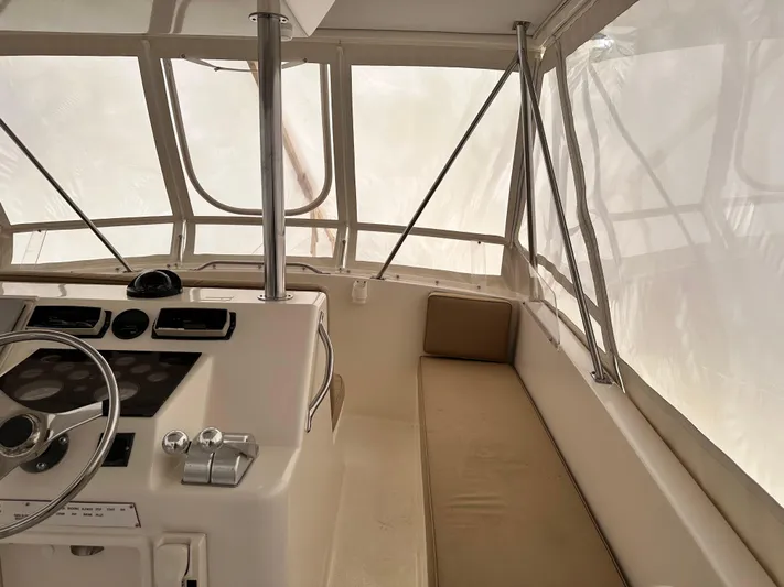 Saylor Moon Yacht Photos Pics Interior view of 1990 Ocean Yachts 48 Super Sport helm with seating and controls.