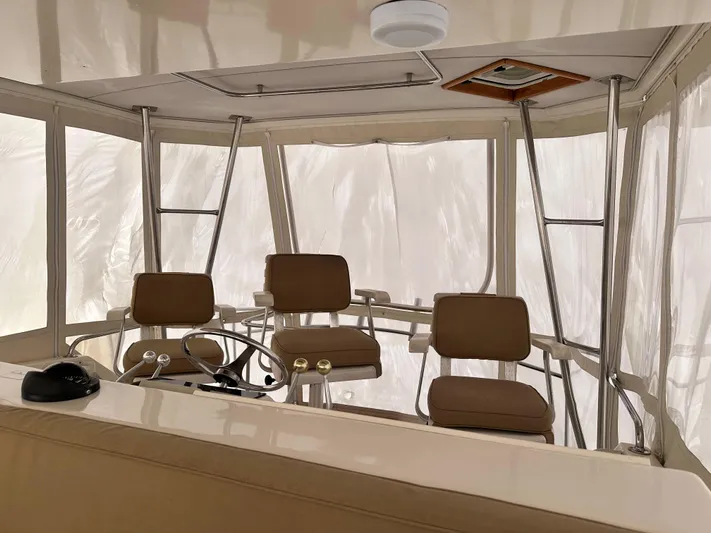 Saylor Moon Yacht Photos Pics Interior of 1990 Ocean Yachts 48 Super Sport with helm and seating area.