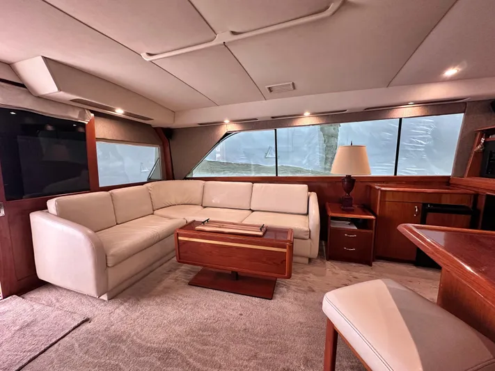Saylor Moon Yacht Photos Pics Luxurious interior of 1990 Ocean Yachts 48 Super Sport with elegant seating and wooden accents.