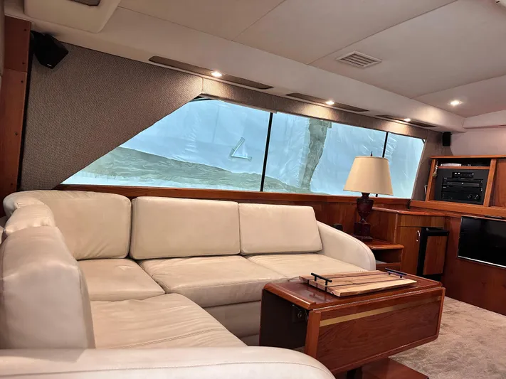 Saylor Moon Yacht Photos Pics Interior of 1990 Ocean Yachts 48 Super Sport with white leather seating and wooden accents.