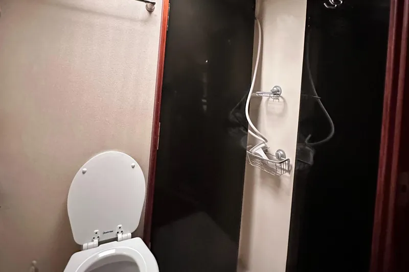 Saylor Moon Yacht Photos Pics Bathroom interior of 1990 Ocean Yachts 48 Super Sport with shower and toilet.