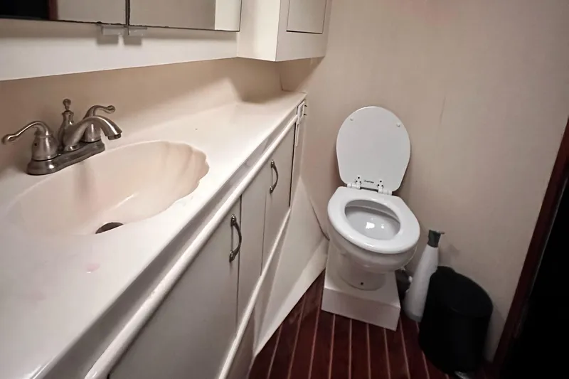 Saylor Moon Yacht Photos Pics Bathroom interior of 1990 Ocean Yachts 48 Super Sport with sink and toilet.