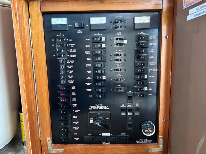 Saylor Moon Yacht Photos Pics Electrical panel of a 1990 Ocean Yachts 48 Super Sport boat, featuring switches and gauges.