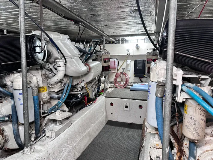 Saylor Moon Yacht Photos Pics Engine room of a 1990 Ocean Yachts 48 Super Sport, showcasing mechanical components and equipment.